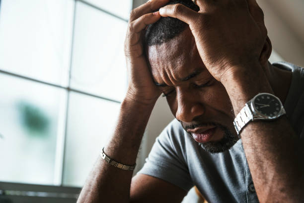 Black guy stressing and headache